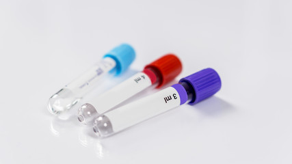 Three bottles for samples used in hospitals or medicine for blood samples, in a laboratory on the white background