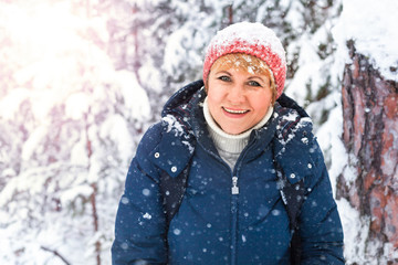 Woman in winter in the forest