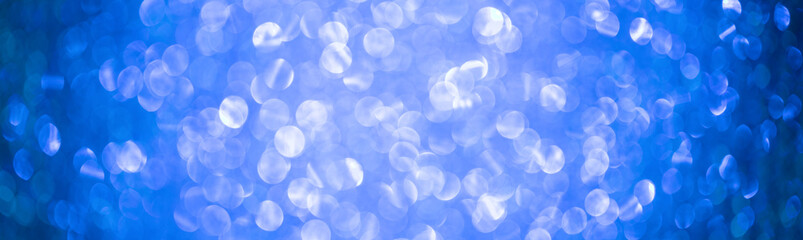 Bright  Abstract Blurred blue Background with Shimmering Glitter Holiday Bokeh. Christmas wallpaper...