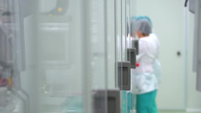 Science lab and female scientist. medical virologist technician assistant working in laboratory, testing medication virology virus vaccine vaccines quality control chemical bacteriological weapons 4 k