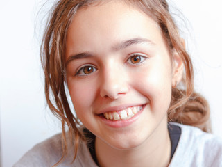 Pretty beautiful young teenager blonde girl with brown eyes close-up portrait