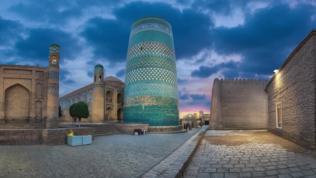 Khiva, Uzbekistan. Cityscape with Kalta Minor minaret at dusk (static image with animated sky)
