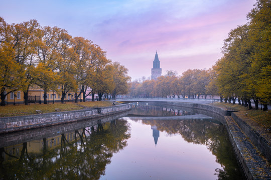 Aura river with beautiful fall foliage with Turku Cathedral in Turku Finland