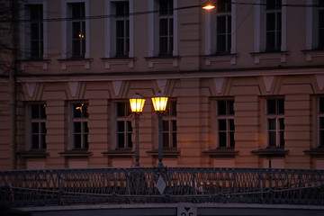 two lanterns burning in the dark