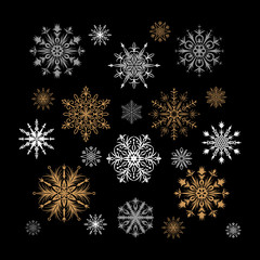 Set of detailed gold, white and gray snowflakes isolated on blac