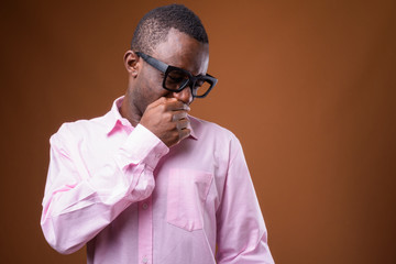 Portrait of young African businessman looking disgusted