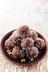 Homemade Raw Chocolate Energy Balls with Nuts, Seeds, and Coconut Chips, in a Plate