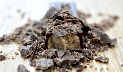 chocolate crumbs on wood background,.shallow dof