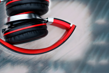 Wooden background in the old style. Musical accessories. headphones are red. memory card. have toning. space for text