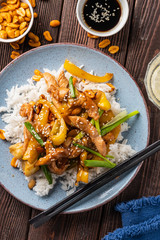 Kung Pao chicken, stir-fried Chinese sichuan traditional sichuan  dish with chicken, peanuts, vegetables and chili peppers.