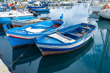 Fototapeta na wymiar Wooden fishing boats on the old port in Palermo, Sicily