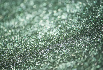 Glitter paper background. Festive sparkle texture. Decorative element for party, birthday, New Year...