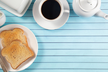 Breakfast of Toast and Hot Coffee on a Blue Wood Table