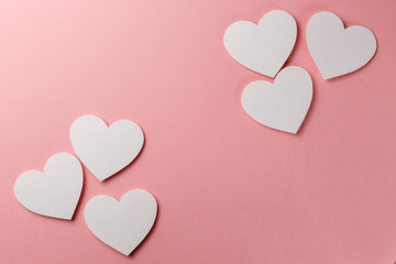 Valentine's Day postcard. Valentine's Day Background. Hearts on pink background. Copy space. Top view. Flat lay. Pastel colors