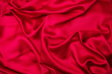 Passion red texture background. Abstract red drapery satin textile.