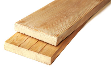 Two larch wood plank boards isolated on white background. Wood planks close up view.