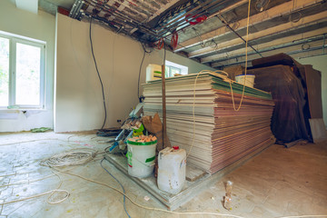 Construction materials and sheets of plasterboard or drywall are prepared for working process of...
