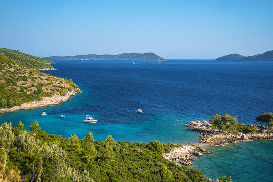 Aerial seascape view to turquoise waters of Adriatic Sea and islands, near town Dubrovnik in Croatia. Famous sailing travel destination in Croatia, Dubrovnik summer scenery in Europe.