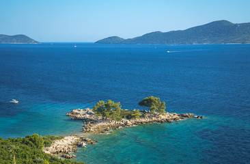 Fototapeta na wymiar Aerial seascape view to turquoise waters of Adriatic Sea and islands, near town Dubrovnik in Croatia. Famous sailing travel destination in Croatia, Dubrovnik summer scenery in Europe.