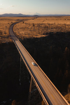 A car driving on a bridge