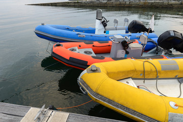 inflatable motor boats on the pier