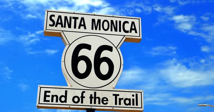 Route 66 end of the trail  landmark sign in Santa Monica Beach, Los Angeles, California, 4K