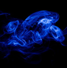 Blue smoke on black background