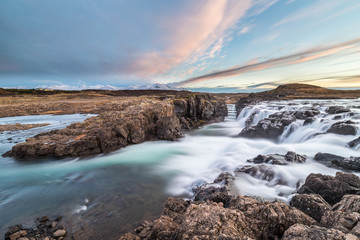 Fototapeta na wymiar River landscape and fabulous waterfalls in Icelandic lands