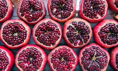 Ripe pomegranate fruit close up in a street market in Tel Aviv, Israel