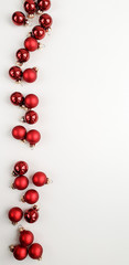 Red frosted and glossy Christmas balls on a white background