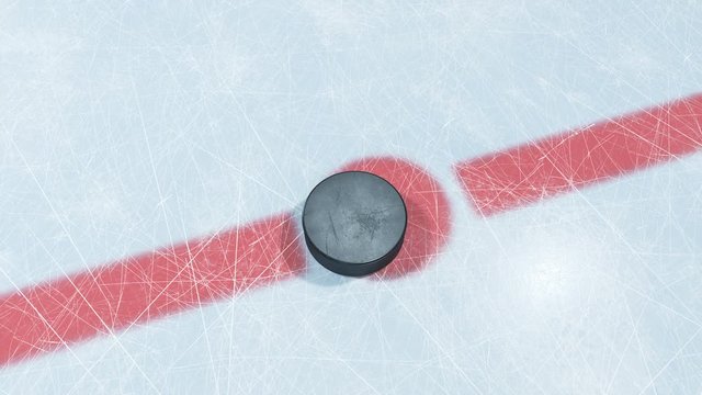 Beautiful Hockey Puck Drop in Face-off Zone. 3d animation of Puck Falling on Ice with and without DOF Blur on Green Screen Alpha Mask. Active Sport Concept. 4k Ultra HD 3840x2160.