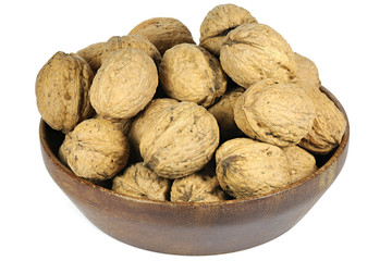 walnuts (variety Red Danube) in a wooden bowl isolated on white background
