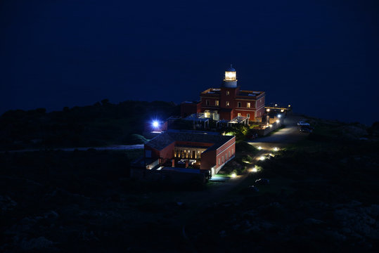 Faro Capo Spartivento at night, Sardinia island, Italy