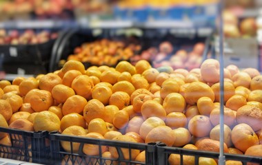 Fresh fruits, tangerines and oranges are sold in the market.