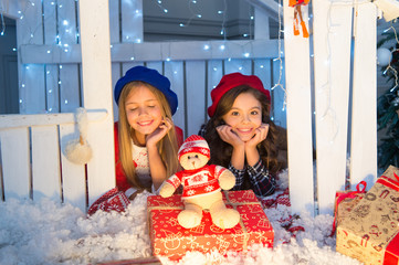 Warmth and togetherness. Happy children in house with xmas decoration. Little children with toy and Christmas gifts. Boxing day is the day after Christmas. New year surprise. Celebrating Boxing day