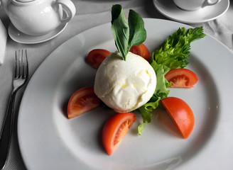 Caprese salad plate served restaurant menu design