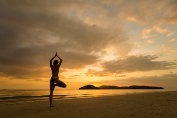 Girl practicing yoga Langkawi island