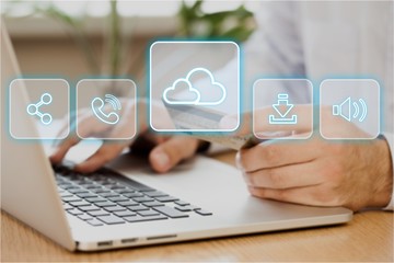 Young business man using laptop and credit card