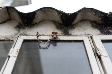 rusty window lock detail