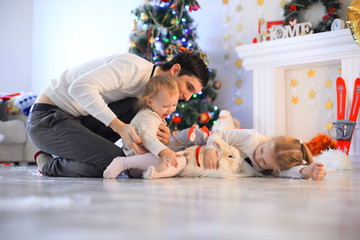 family, christmas, x-mas, happiness and people concept - smiling father and daughter holding gift box