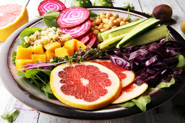 Bowl of Buddha, The concept of a healthy diet: chickpeas, salad, beetroot, pumpkin, cucumber, grapefruit, cabbage and tabouleh. Balanced food.