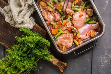 Prepared for baking chicken meat with vegetables.