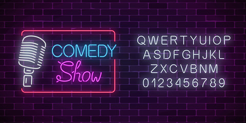 Neon comedy show sign with retro microphone and alphabet. Humor monolog glowing signboard.