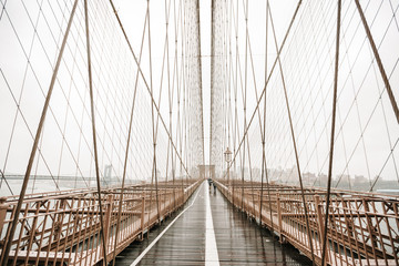 The Brooklyn bridge, New York City, USA. Rainy day in New York.