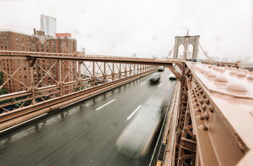 The Brooklyn bridge, New York City, USA. Rainy day in New York.