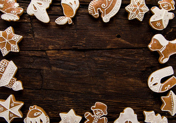 Christmas homemade gingerbread cookies on old wooden table.
