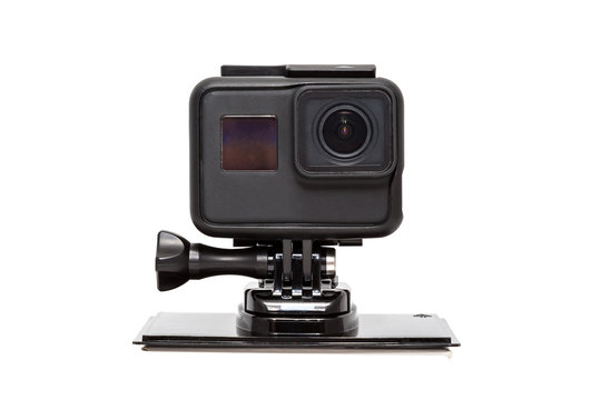 New 4K action camera in black color. Isolated white background