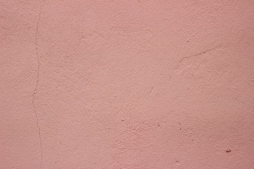 Wall plaster cement surface pastel pink stain texture surface close up