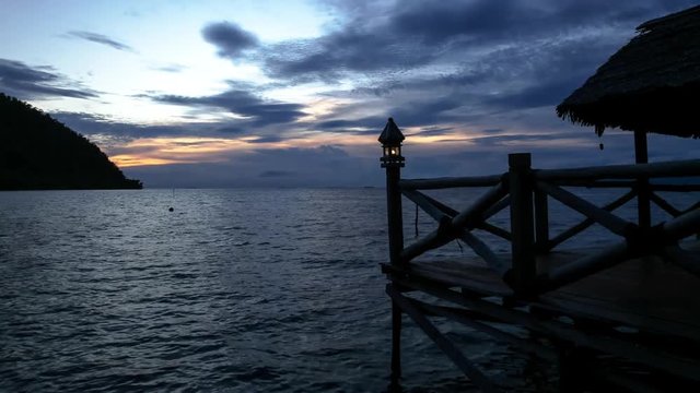 Wide timelapse, sunset over hut in Piaynemo Raja Ampat