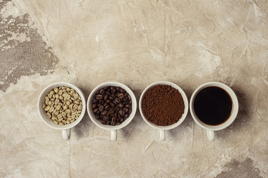 four types of coffee unroasted, bean, ground and one in cup